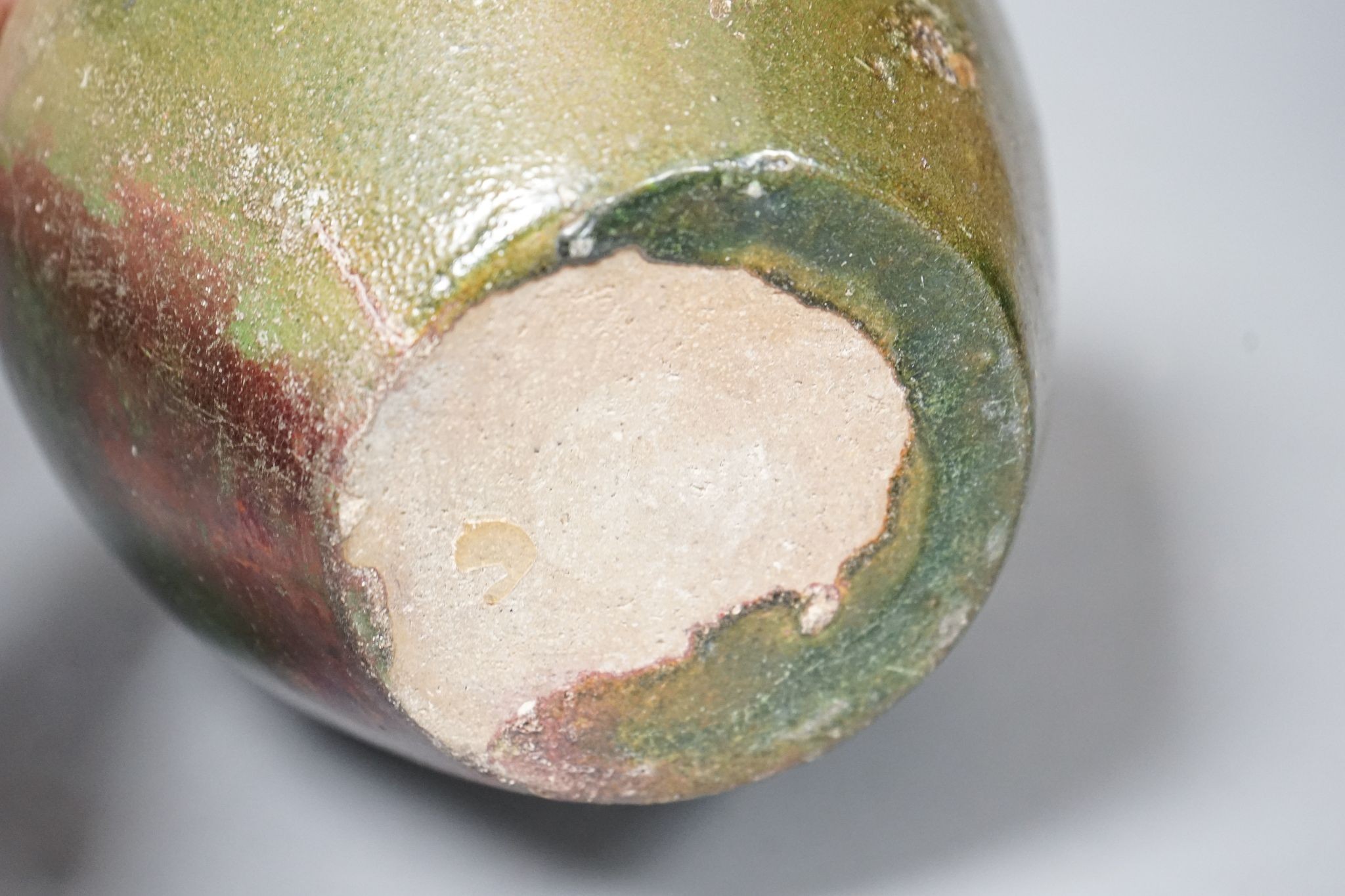 A copper lustre and green glazed pottery jar, 17.5cm high